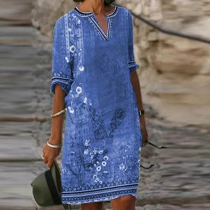 LP | Abito midi verde con scollo a V e motivo floreale